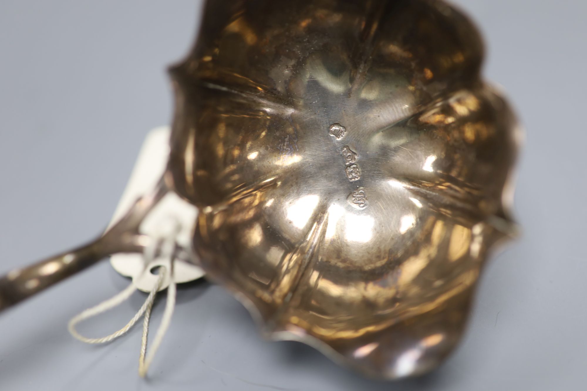 A George II silver toddy ladle, with turned wooden handle, John Pollock, London, 1742, 37.8cm, gross 81 grams.